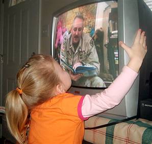 daughter kisses dad on tv
